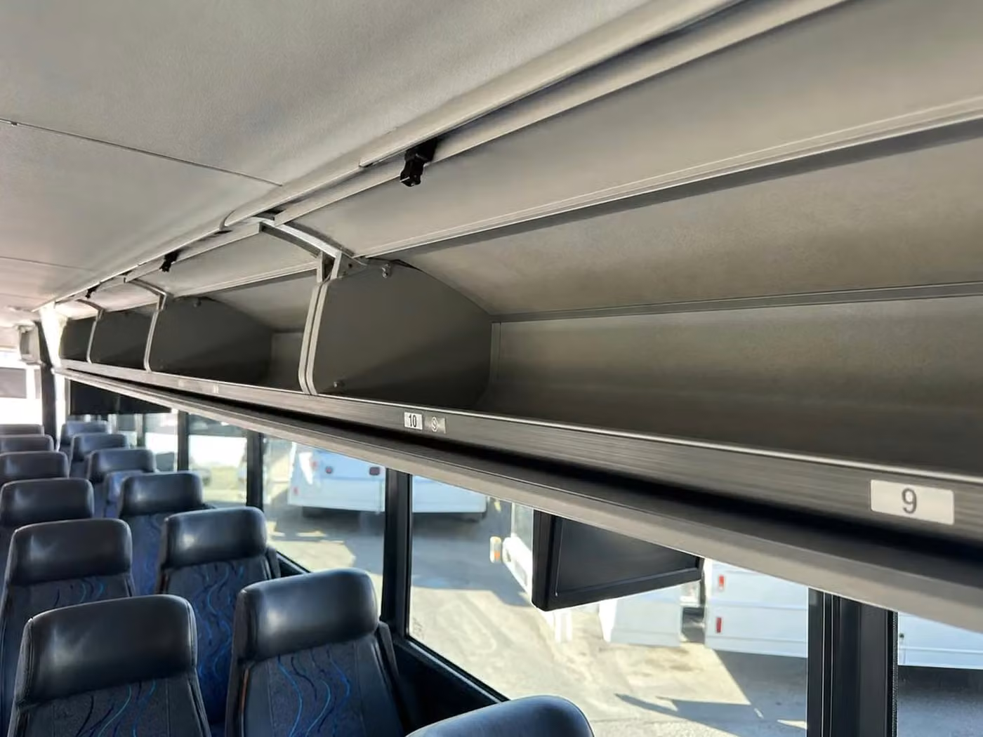 cedar rapids 56 passenger charter bus overhead storage